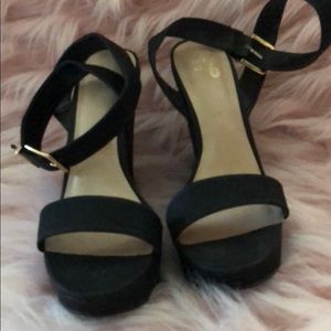 Black wedges. Strap wraps around ankle. Worn once